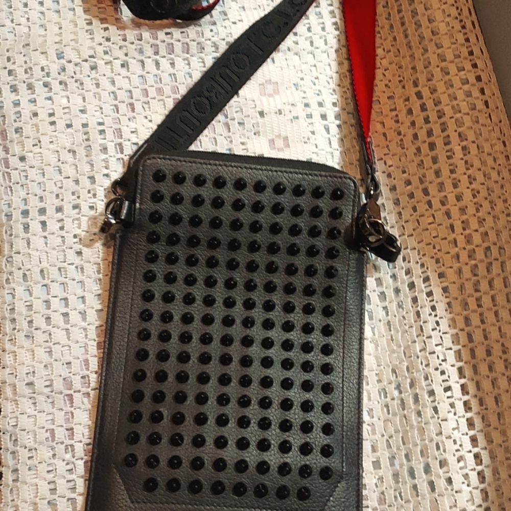 C.Louboutin Red and black spiked messenger bag